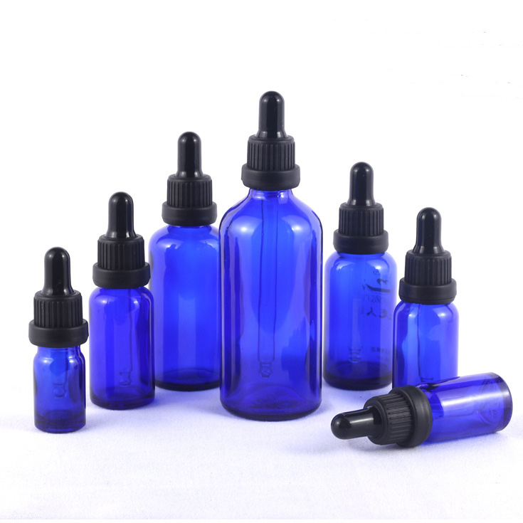 blue glass bottle essential oil screw cap.jpg